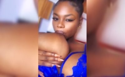 Catherine Sucking Her Massive Breasts